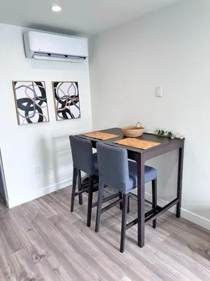 a dining room table and chairs in a room at New built house in Los Angeles! in Los Angeles