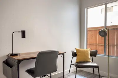an office with a desk and a chair at Blueground Fairfax pool nr mall dining LAX-1185 in Los Angeles