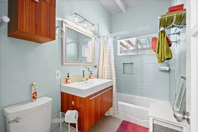 a bathroom with a sink and a toilet and a shower at Valley Glen Getaway in Van Nuys
