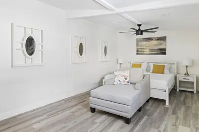 a living room with a chair and a couch at Valley Glen Getaway in Van Nuys