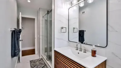 a white bathroom with a sink and a shower at H&H Modern Lux 4BD 1 King Suite 3 Queen SoCal Disney in Westminster