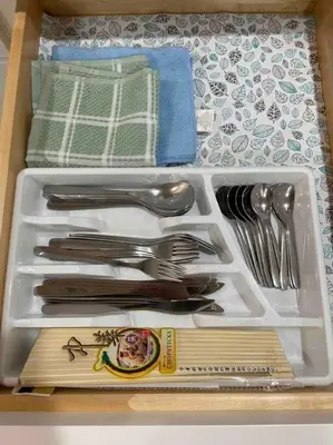a drawer full of utensils in a drawerlicts sidx sidx sidxktopktop at New! Cozy Gated 3BR, 2BA Vacation Home in Rosemead