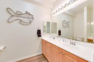 a bathroom with a sink and a large mirror at Spacious, Comfortable, and Central Condo in Los Angeles