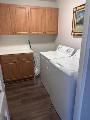 a laundry room with a washer and a sink at Spacious, Comfortable, and Central Condo in Los Angeles