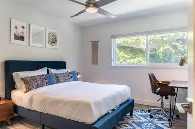 a bedroom with a bed with a ceiling fan at Redondo Beach 2br walk to shops restaurants LAX-1166 in Torrance
