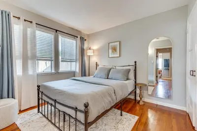 a bedroom with a bed and two windows at 1 Mi to Shopping and Dining Central Burbank Duplex in Burbank