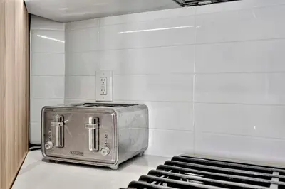 a toaster oven sitting on top of a counter at 13 Luxury apartment in Los Angeles