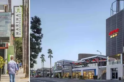 a man walking down a street in front of a building at Luxe MDR apartment,Parking, Gym, Pool, jacuzzi,BBQ in Los Angeles