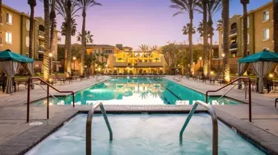 a pool at a resort with palm trees and buildings at Nautical 2 Bedroom with Beautiful Ocean Views in Los Angeles