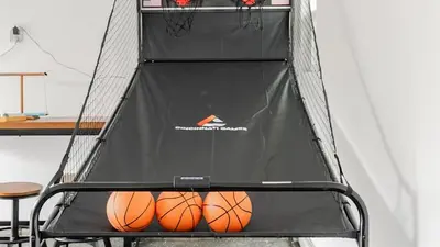 a basketball hoop with two basketballs on it at Private Pool Retreat Near Disney Game Room & Firepit in Fullerton