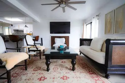 a living room with a couch and a table at SeaView, Pool, HotTub, W/D, Bikes, Gated Community in Port Hueneme