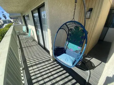 a swing hanging off the side of a house at SeaView, Pool, HotTub, W/D, Bikes, Gated Community in Port Hueneme