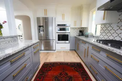 a kitchen with stainless steel appliances and a rug at SeaView, Pool, HotTub, W/D, Bikes, Gated Community in Port Hueneme