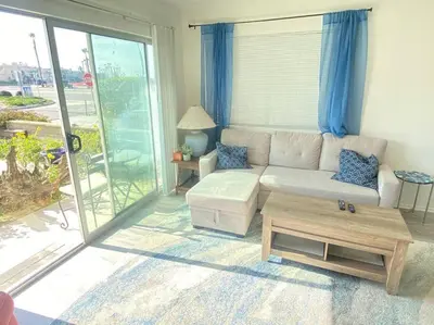 a living room with a couch and a table at Sea View, Boards, Bikes, W/d in Oxnard