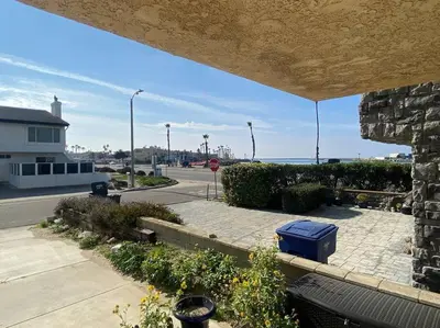 a view of a parking lot with a street and the ocean at Sea View, Boards, Bikes, W/d in Oxnard
