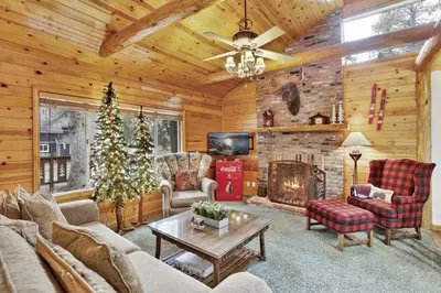 a living room filled with furniture and a fireplace at Timber Pines Chalet~ Hot Tub~ Walk to Lake/Marina~ in Big Bear Lake