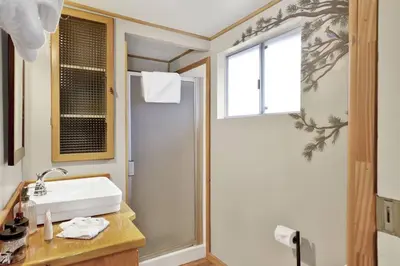 a bathroom with a sink and a shower at Timber Pines Chalet~ Hot Tub~ Walk to Lake/Marina~ in Big Bear Lake