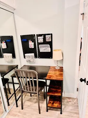 a dining room with a table and a chair at Walk To Americana on Brand. in Glendale