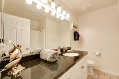 a white bathroom with a sink and a mirror at Marina Life: Smell the Sea, Feel the Breeze in Los Angeles