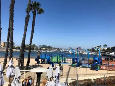 a playground on a beach with palm trees at Marina Life: Smell the Sea, Feel the Breeze in Los Angeles