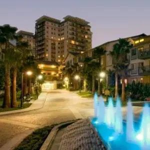 a row of blue lights on a city street at night at Marina Life: Smell the Sea, Feel the Breeze in Los Angeles