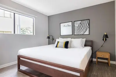 a bedroom with a large white bed and a window at Westwood 1BR w Gym Pool Spa nr UCLA LAX-265 in Los Angeles
