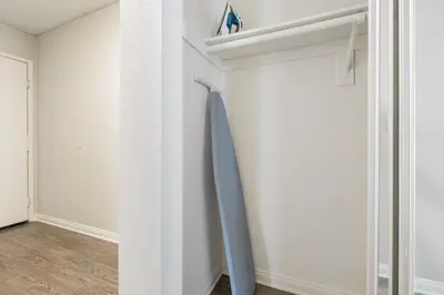 a blue surfboard hanging on a wall in a room at Westwood 1BR w Gym Pool Spa nr UCLA LAX-265 in Los Angeles
