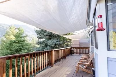 a porch with benches and awnings on a house at Apres-Ski Chalet Mt High Wrightwood Ski Resort in Wrightwood