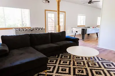 a living room with a couch and a table at Apres-Ski Chalet Mt High Wrightwood Ski Resort in Wrightwood
