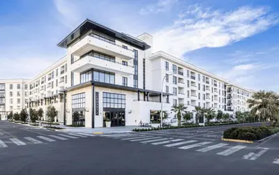 a large white building with a parking lot at Inglewood 1br w sundeck clubhouse nr shopping LAX-1160 in Inglewood