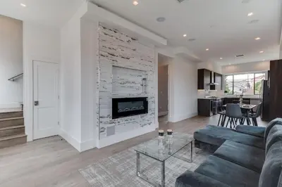 a living room with a couch and a fireplace at Luxury Modern 4 Bedroom 4 Bathroom Home with Rooftop Deck #4 in Los Angeles