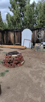 a pile of bricks in a yard next to a fence at Private Guest Cozy Room w/Full Bathroom in Lake Isabella