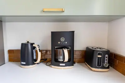 two coffeemakers sitting on a counter in a kitchen at Luxury 2br 2ba Beverly Hills Near Cedars Sinai in Los Angeles