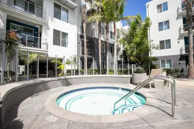a swimming pool in the courtyard of a building at Playa Vista 1BR w Pool Gym Spa nr the beach LAX-138 in Los Angeles