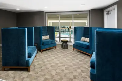 a row of blue chairs in a waiting room at Playa Vista 1BR w Pool Gym Spa nr the beach LAX-138 in Los Angeles