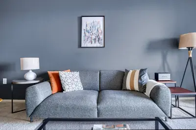 a living room with a gray couch with colorful pillows at Playa Vista 1BR w Pool Gym Spa nr the beach LAX-138 in Los Angeles