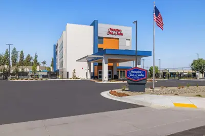 a gas station with a sign in front of it at Hampton Inn & Suites Bakersfield Central in Bakersfield