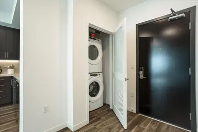 a laundry room with a washer and dryer in it at Luxury 1BDR centrally located in Hollywood in Los Angeles