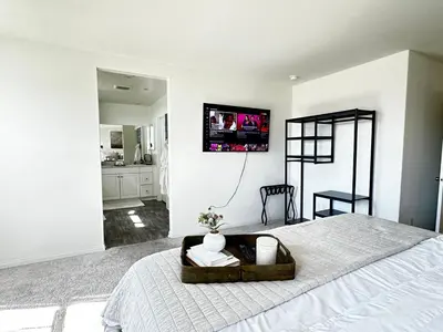 a bedroom with a bed with a tv on the wall at Claremont Colleges And Ontairo Mills Single Villa stay more 30 nights in Upland