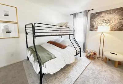 a bedroom with a bunk bed and a lamp at Claremont Colleges And Ontairo Mills Single Villa stay more 30 nights in Upland