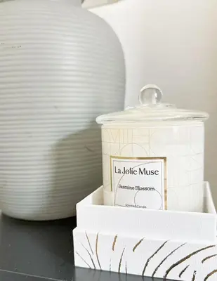 a candle sitting on a table next to plates at Claremont Colleges And Ontairo Mills Single Villa stay more 30 nights in Upland