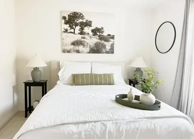 a white bed with a tray on top of it at Claremont Colleges And Ontairo Mills Single Villa stay more 30 nights in Upland