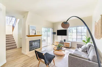 a living room with a couch and a fireplace at Thousand Oaks 2br near shopping dining bars LAX-1157 in Oak Park
