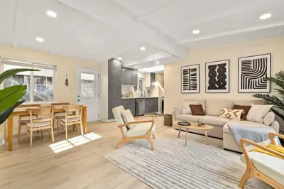 a living room with a couch and a table at Charming Zen Venice Beach 3BR Home w/Patio & W/D in Los Angeles