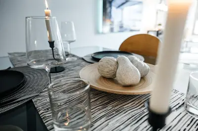 a table with a wooden plate with rocks on it at Luxurious Hollywood condo in Los Angeles