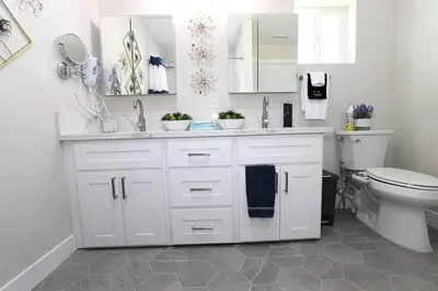 a white bathroom with a toilet and a sink at NEW! 2-Bedroom Fontana Guest House close to Kaiser Permanente in Fontana