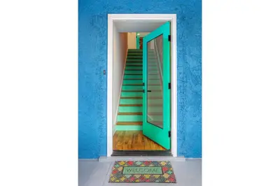 a staircase in a blue room with a blue wall at Peace Palace 4803 in Los Angeles