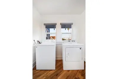 a kitchen with two sinks and a dishwasher at Peace Palace 4803 in Los Angeles