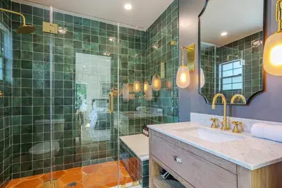 a bathroom with a sink and a glass shower at New Home Universal sleeps 18 hot tub in Los Angeles