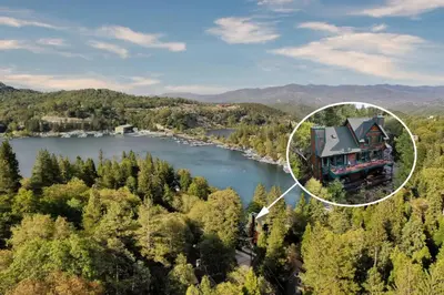 an aerial view of a house on a lake at Lake Reflection Point Upscale Lake House 4 Bed and 4.5 Bath in Lake Arrowhead